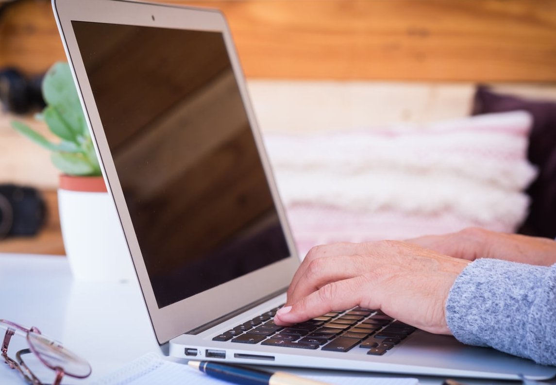 logo designer working laptop